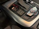 a close up of a car ' s gear knob and controls