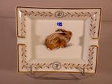 a small plate with a picture of a mouse on it