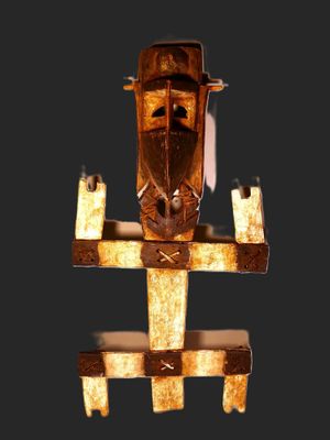 an image of a wooden sculpture of a man on a boat