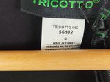 a close up of a label on the back of a black shirt