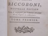 an old book is open on a table with a white background