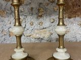 two candles that are sitting on a table