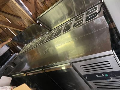 a large stainless steel oven that is in the kitchen