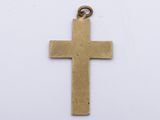an image of a gold cross pendant on a white background