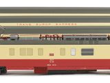 a train that is sitting on the tracks on a white surface
