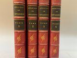 un ensemble de cinq livres rouges avec des lettres dorées