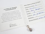 a card that has a picture of a pearl on it