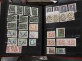 a book with stamps and stamps on it sitting on a table