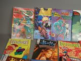 a lot of comic books that are on the table