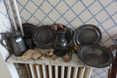 a lot of pots and pans that are on a table