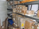 many boxes and boxes on the shelves in the storage room