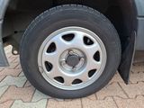 a close up of a car tire on a brick road