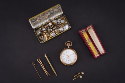 a box with a pocket watch, a pair of scissors, and a pair of pins