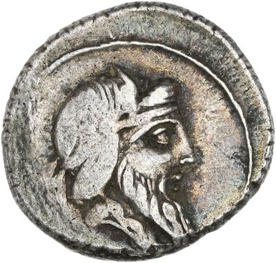 une pièce d'argent à l'effigie d'un homme barbu