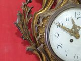 a clock that is hanging on the wall in the room