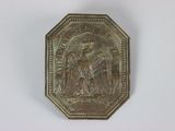 une image représentant une médaille d'or sur fond blanc