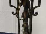 a lamp that is on a table with flowers on it