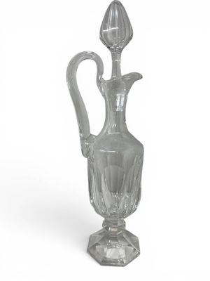 a clear glass vase with a flower on the top of it