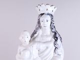 a statue of a woman holding a baby in her arms