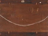 an old wooden box with a rope on top of it