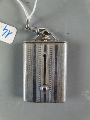a silver lighter with a tag attached to it