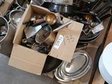 a lot of pots and pans that are in a box
