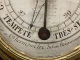 a close up of a clock with roman numerals on it