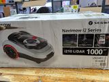 packaging of a vacuum cleaner on a wooden table in a store