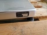 a laptop sitting on top of a wooden table