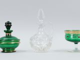 three glass vases sitting next to each other on a table