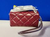 a red purse that is sitting on a table
