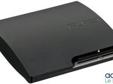 a close up of a sony playstation game console on a white background