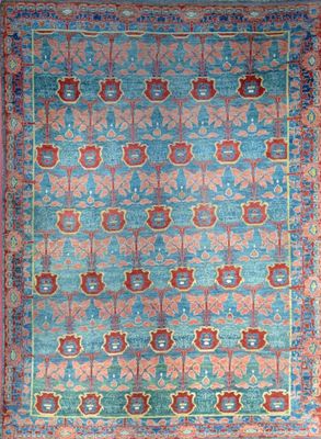 a blue and red rug with a medallion design