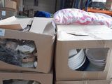 many boxes stacked on top of each other in a warehouse