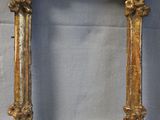 an old gold frame with a decorative design on it