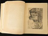an open book with a drawing of a woman ' s face on it