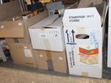 a pile of boxes sitting on the ground next to a refrigerator