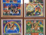four framed pictures of different religious scenes on a wall