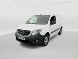 a white van is parked in a white room