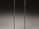 two white lamps sitting on top of a table next to each other