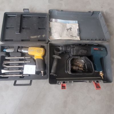 a box with tools in it sitting on the floor