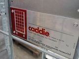 a sign that says caddie on the side of a building