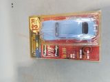 a toy car that is in a package on a table