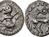 a close up of a coin with a horse on it