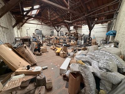 a room filled with lots of boxes and other things
