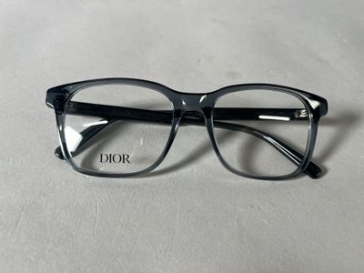 black glasses with clear lenses on a white surface