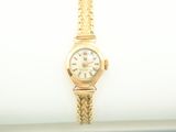 an image of a lady ' s wrist watch sitting on a napkin