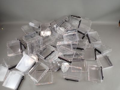 a pile of clear plastic containers on a table