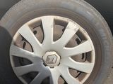 a white car with a flat tire on the street