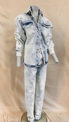 jean jacket and pants on a mannequin stand against a white backdrop